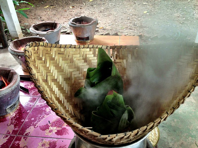 Steaming Mekong fish in banana leaves