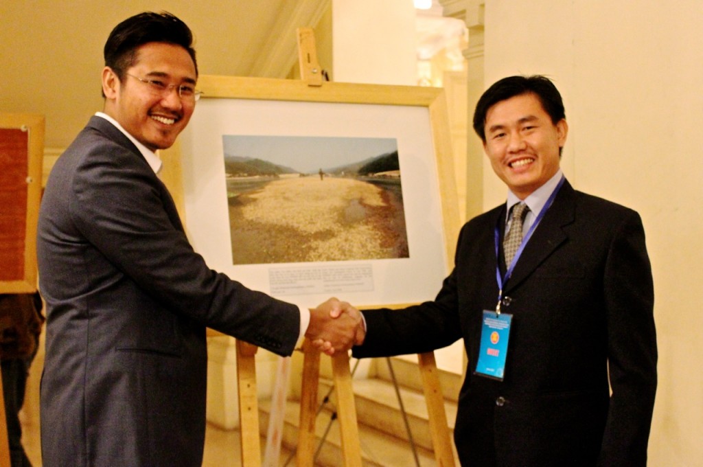 Sinsamout (right) receives congratulations on his photo entry