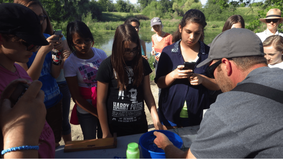 Girls learn to measure salmong