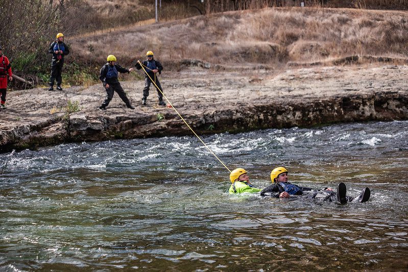 Swiftwater rescue training with rope