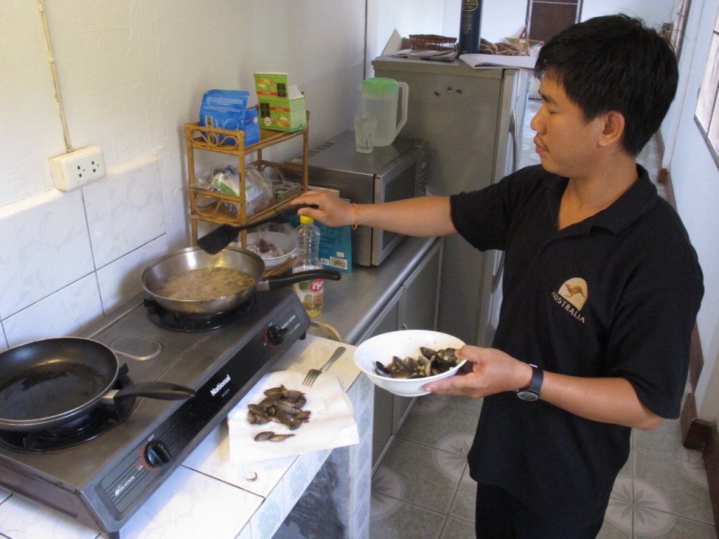 Cooking climbing perch at the FiSHBIO Lao office