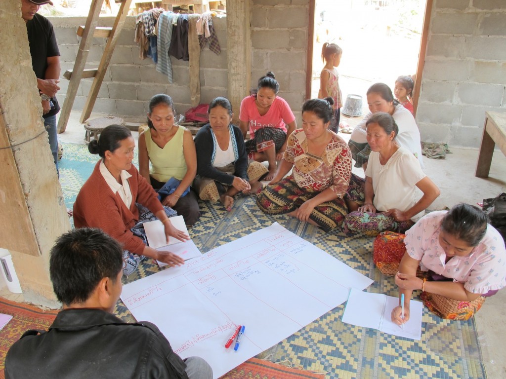 A village women's group discusses the proposed Fish Conservation Zone